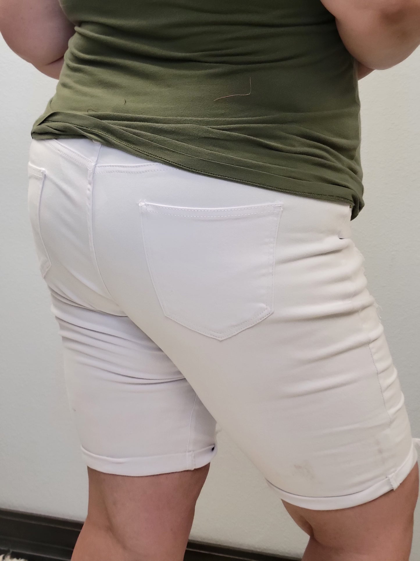 Distressed white denim shorts